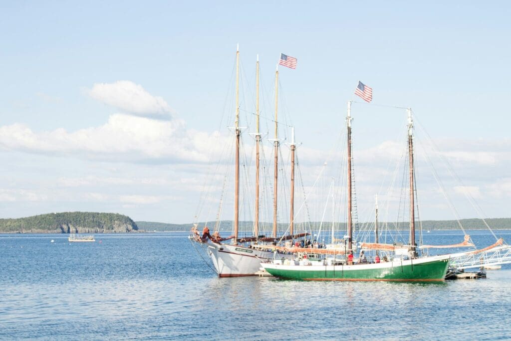 New England's shore with sailboats, as one of the best places to visit in the US